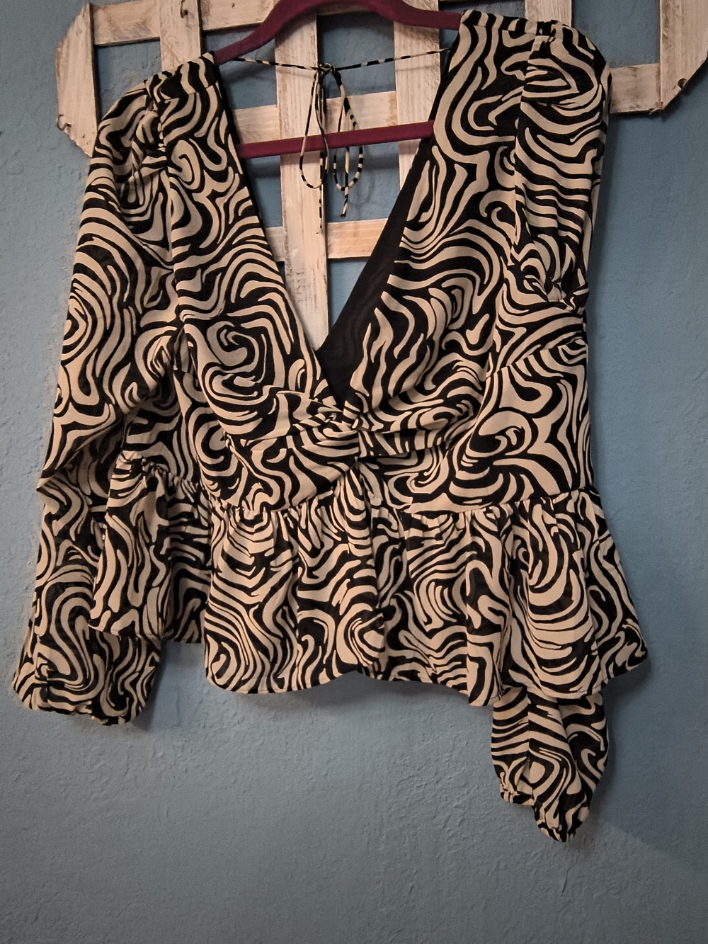 H&M Black and Cream Swirl V-Neck Peplum Blouse